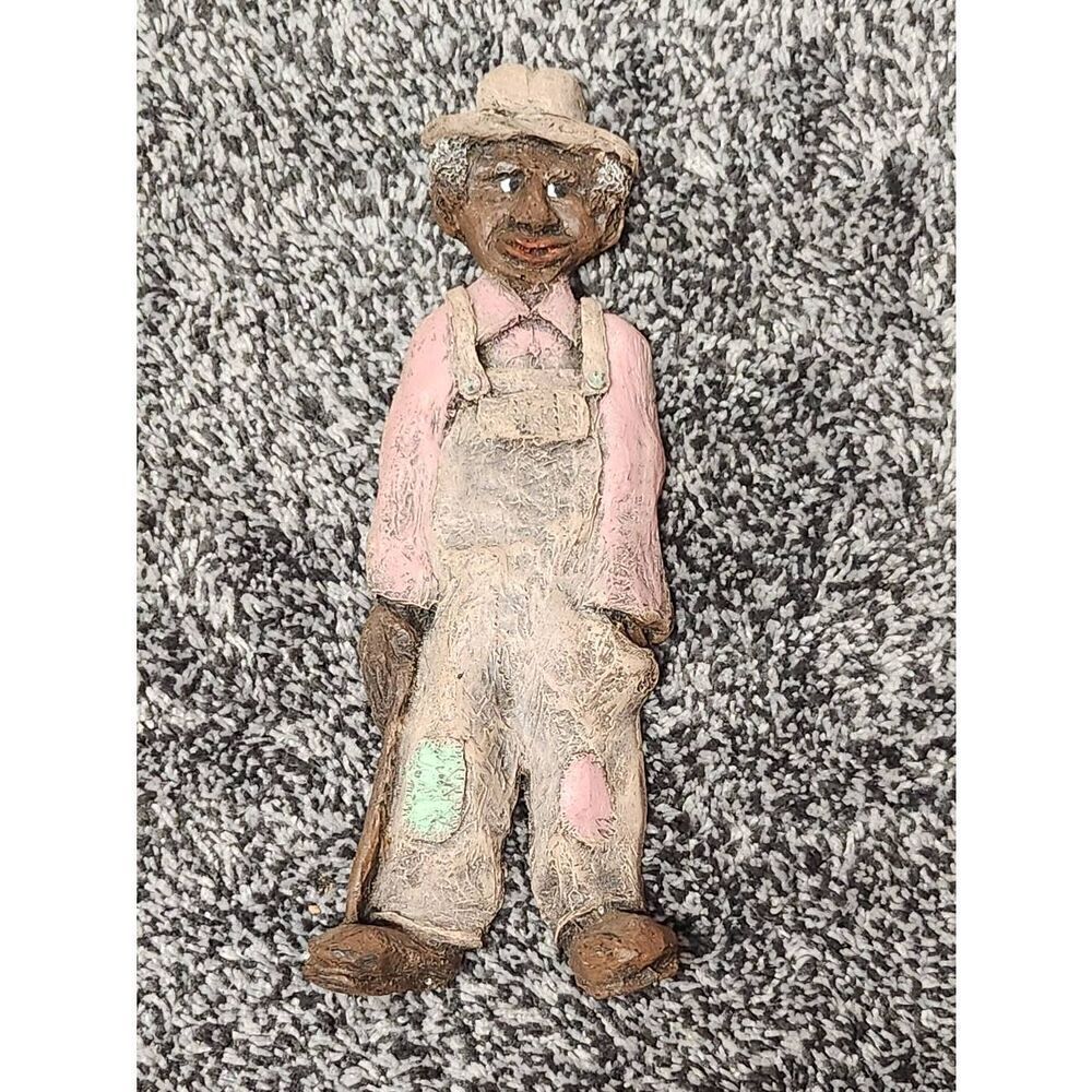 Man wearing overalls Figurine